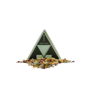 Fresh Blend herbal smoking mix in a triangle box with loose dried botanicals including rose petals, calendula and herbs spilling out in front
